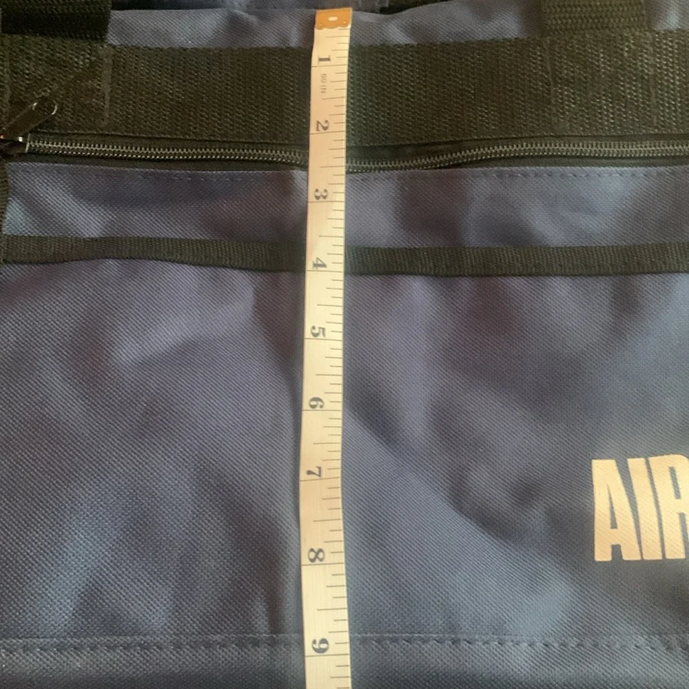 Smithsonian Air & Space blue and black duffel bag. Approx 17” x 9” x 7 1/4”